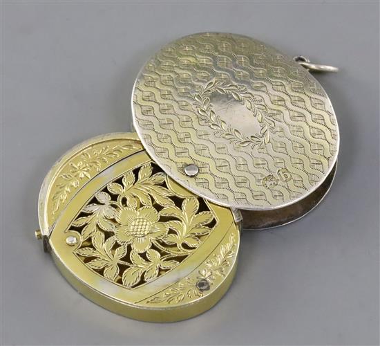 A George III engraved silver gilt oval vinaigrette by William Troby, gross 36 grams.
